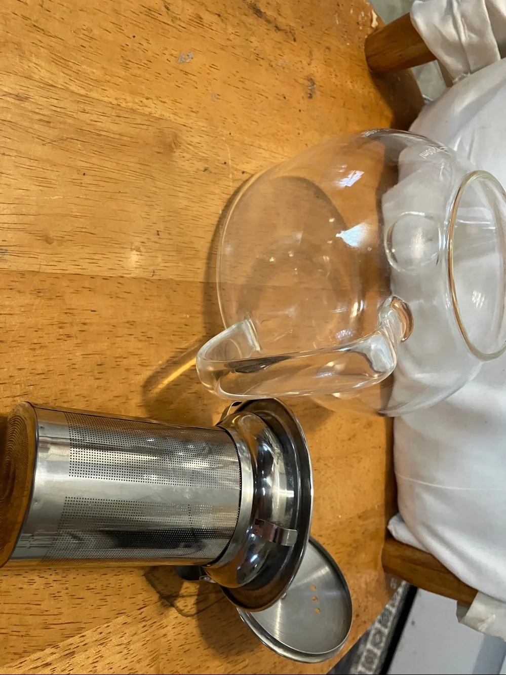 Like new. French press style glass tea pot with stainless steel pieces